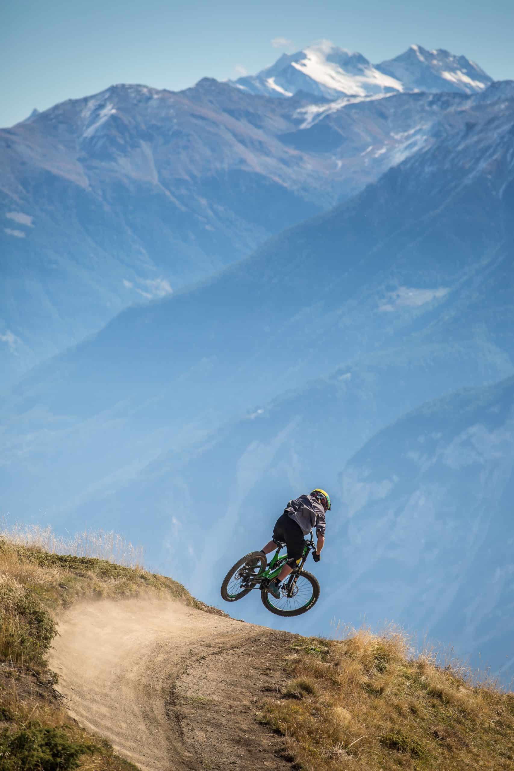 biker riding in the middle of the Mountains, near Crans-Montana